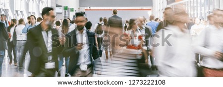 blurred business people at a trade fair