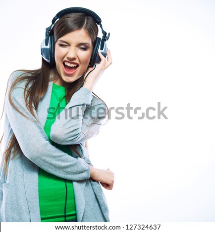 Woman with headphones listening music .Music teenager girl dancing against isolated white background