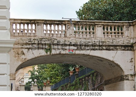 Invader art or space invader street mosaic on a bridge in Rome over Via Della Pilotta linking the Colonna Palace to the Quirinale gardens at the base of the Quirinal Hill home of the Italian president Royalty-Free Stock Photo #1273280320