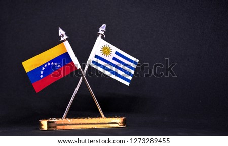 Venezuela and Uruguay table flag with black Background