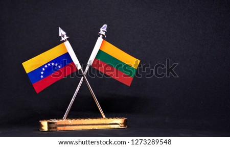 Venezuela and Lithuania table flag with black Background