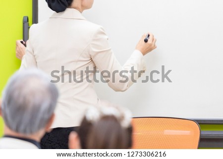 teacher talking at a seminar