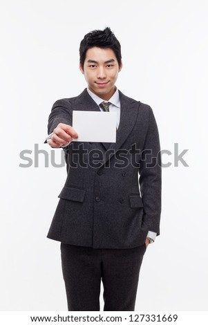 Asian young business man with blank card isolated on white background.