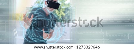 Senior man using a virtual reality headset, light effect. panoramic banner