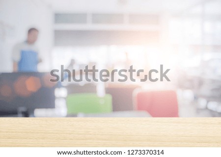 Businessmen blur in the workplace or work space of laptop on table in office room with computer or shallow depth of focus of abstract background. - Image