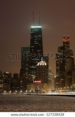 The Chicago skyline centered on the John Hancock Center with a frozen Lake Michigan in the foreground