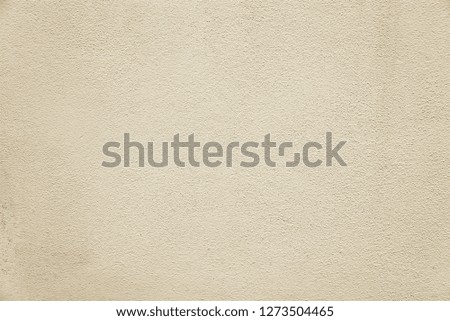 Old beige concrete wall background texture close up