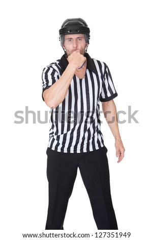 Portrait of hockey judge whistling. Isolated on white
