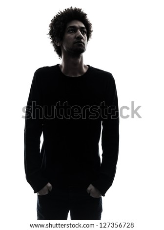one african handsome young man looking away in silhouette studio isolated on white background