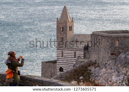 Porto Venere (La Spezia) , Italy - Church of San Pietro erected in 1198 on a rocky spur at the end of the village overlooking the open sea (sunset photo of a winter day)