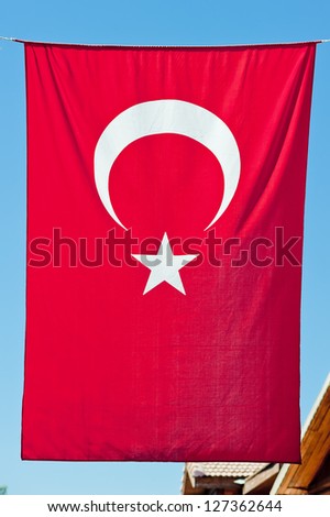 Turkish flag hanging vertically.