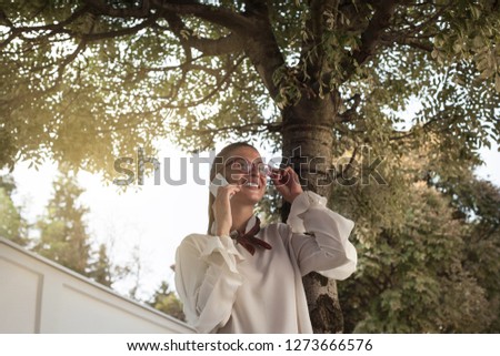 Woman smiling during  phone call.