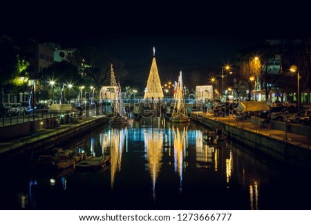 Scenic view of the Christmas Tree on a bridge at night, with reflections. Long exposure picture in Riccione, Emilia Romagna, Italy.