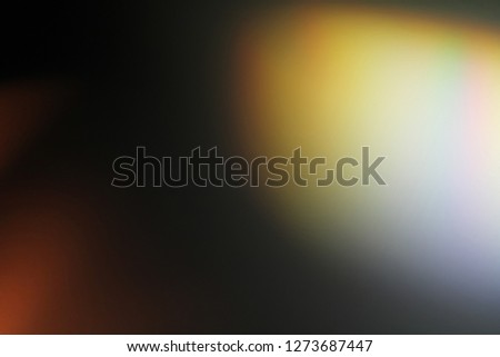 Lens flare effect. Photo using prism. Bottom right corner in rainbow illumination