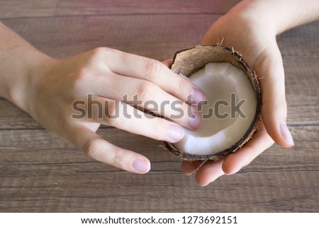 Coconut cream hand care, natural cosmetics. Seasonal hand care. Hand Moisturizer. Beauty and spa concept. Royalty-Free Stock Photo #1273692151