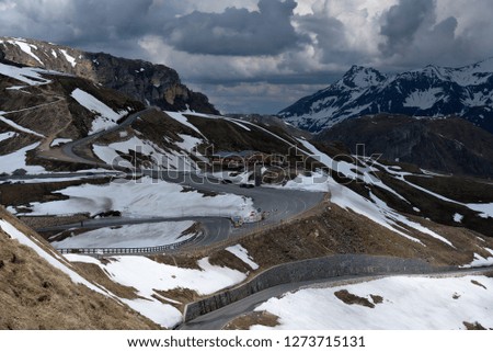
Panoramic view of beautiful snowy mountain road with blue sky from Grossglockner High Alpine Road in Austria.