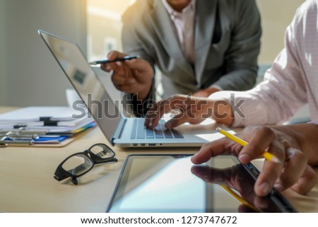 double exposure of business man hand working on laptop computer on wooden desk with social media network diagram