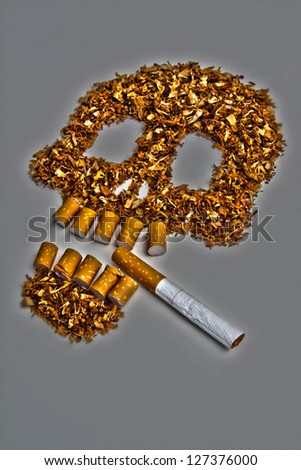 Death sign skull made of Tobacco on gray background. Smoking metaphor