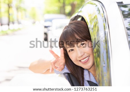 Asian middle age woman in a car