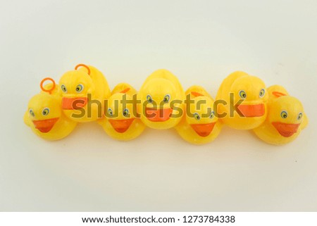 Arrangement of yellow rubber duck on white background