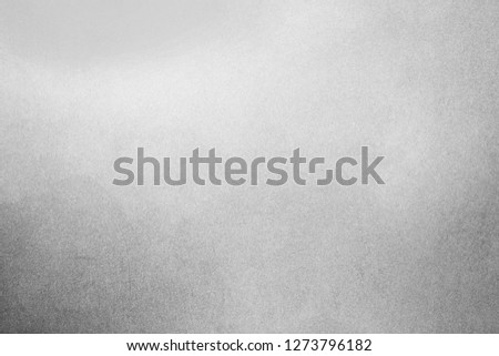 White-gray texture for the background. Rough classic surface. Concrete wall. Spray paint. Bright backdrop. Monochrome image. Bump texture