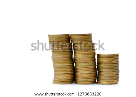 old & used golden coins stack up in white background