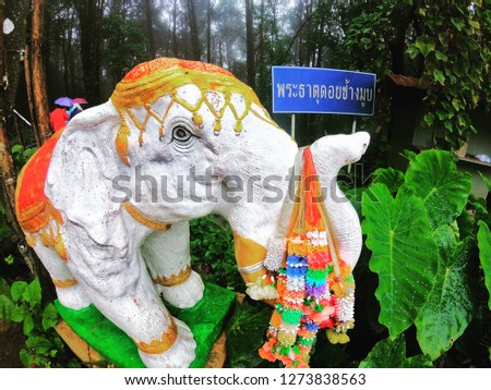 elephant statue. 
The text in picture means temple. 