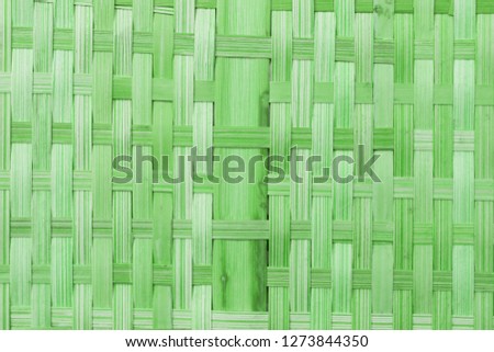 Green bamboo weaving background texture.  Pattern of bamboo strips.