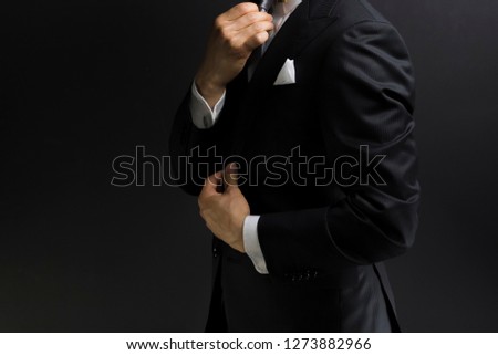 businessman wearing a black suit