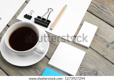 Mock up set of id template, notebook and cup of coffee. Coffee break background
