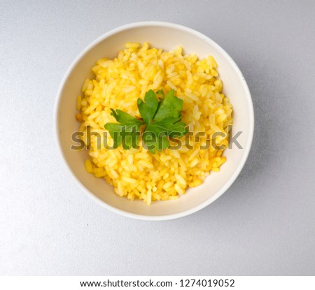 Fine lunch, yellow rice with saffron Royalty-Free Stock Photo #1274019052