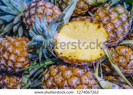 Fresh ripe pineapples at fruit market,tropical fruit juice,diet fruit,vegetarian,high fiber