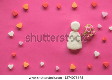 many hearts around blank pink background and icon cartoon woman with pink flowers, Love icon, valentine's day, relationships concept with copy space