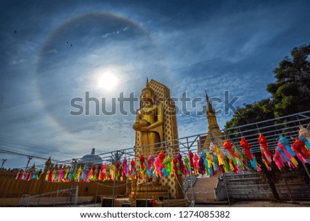 Sun halo with blue sky with Buddha statue at in Temple (Thai language:Wat Chan West) is a Buddhist temple It is a major tourist attraction Phitsanulok, Thailand