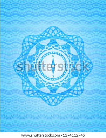 compass icon inside water wave emblem background.