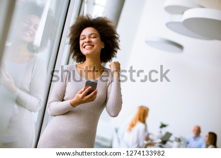 Portrait of a young African American  businesswoman using mobile phone