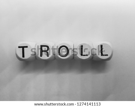 word troll spelled on dice