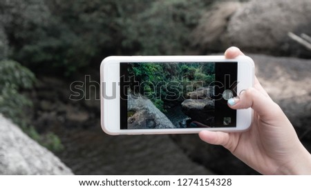 take a photo at waterfall