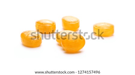 Orange flavored hard candies with isolated on white background 