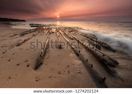 Lake Superior sunset, over Michigan’s Graveyard Coast, lights the bones of shipwrecks on Au Sable Point near Grand Marais. These are the mixed remains of the Sitka and Grand Staples two-masted freight