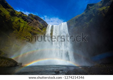 Rainbow in the impressive skogarfoss waterfall south of iceland