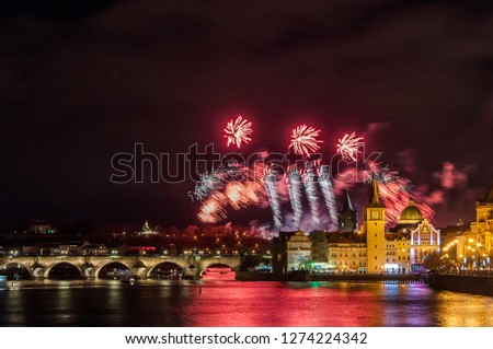 Night photo of New Year Firework 2019 in Prague. Beautiful lightshow with Charles Bridge in background at the center of Prague