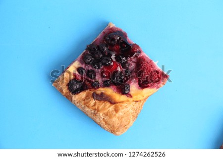 delicious piece of strawberry and blueberry pie
