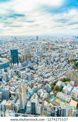 Asia Business concept for real estate and corporate construction - urban city skyline aerial view under bright blue sky and sun in Tokyo, Japan
