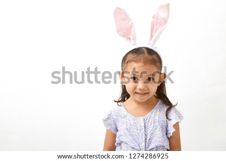 4 years old Asian girl acting as a little easter day  bunny on white back