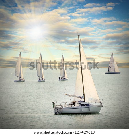 The Sailboats on a sea against a dramatic sky. Retro style picture.