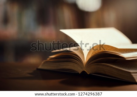 Book in library with open textbook,education learning concept Royalty-Free Stock Photo #1274296387