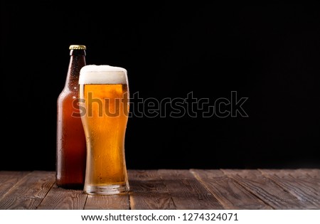 Photo of buttle and glass of beer