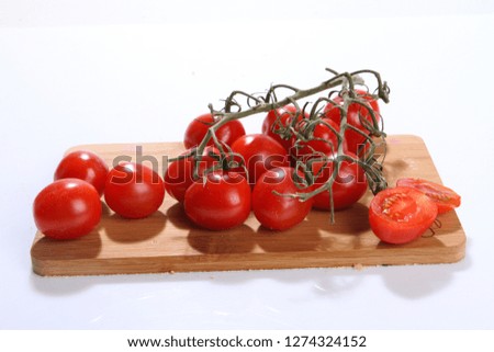Fresh tomatoes on white background.