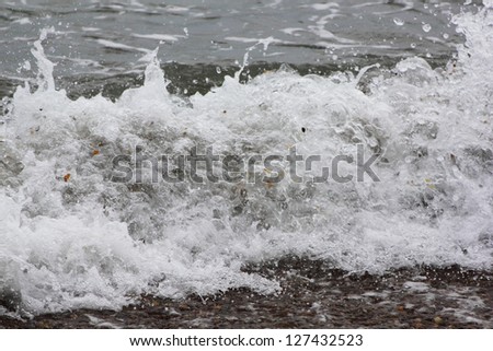 Wave washed over the sandy beach